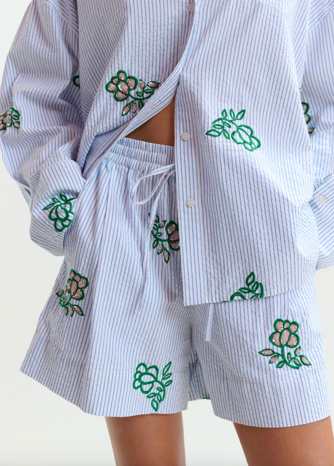 Juste Embroidered Mini Shorts in Light Blue Pinstipes and Embroidered Details